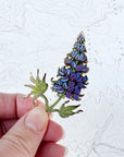 final switchback alpine lupine enamel pin created by artist Katie Jeanne Reim