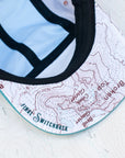 brim view of the final switchback 5-panel trail hat featuring artist Katie Jeanne Reim's half-dome print