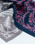 close-up of two final switchback cotton bandanas in Deep Forest wildberry and stone featuring artist Katie Jeanne Reim's prints