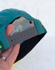 back view of the final switchback 5-panel trail hat featuring artist Katie Jeanne Reim's Fern print
