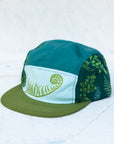 angle view of the final switchback 5-panel trail hat featuring artist Katie Jeanne Reim's Fern print