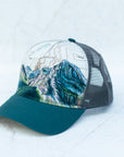 angle view of the final switchback trucker hat featuring artist Katie Jeanne Reim's Glacier Grinnell print