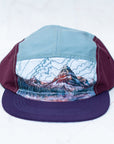 front view of the final switchback 5-panel trail hat featuring artist Katie Jeanne Reim's Glacier Two Medicine print