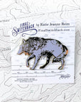 final switchback grey wolf enamel pin on holder created by artist Katie Jeanne Reim