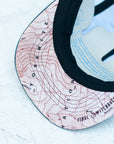 brim view of the final switchback 5-panel trail hat featuring artist Katie Jeanne Reim's half-dome print