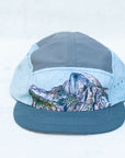front view of the final switchback 5-panel trail hat featuring artist Katie Jeanne Reim's half-dome print