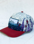 angle view of the final switchback twill hat featuring artist Katie Jeanne Reim's Mount Rainier Meadow print
