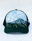 front view of the final switchback trucker hat featuring artist Katie Jeanne Reim's Mount Rainier Tatoosh print