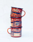 Three stacked final switchback fireproof enamel mugs featuring artist Katie Jeanne Reim's Mount Hood Seasons print
