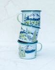 Three stacked final switchback fireproof enamel mugs featuring artist Katie Jeanne Reim's Mount Rainier Seasons print