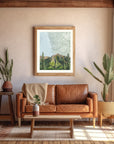 A large frame with a final switchback by artist Katie Jeanne Ream print on the wall in an earthy office