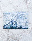 a final switchback button magnet featuring Katie Jeanne Reim's mount hood blue print
