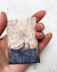 a final switchback button magnet featuring artist Katie Jeanne Reim's Mount Hood Lolo Pass print