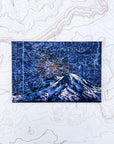 a final switchback button magnet featuring Katie Jeanne Reim's mount rainier night print