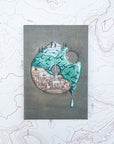 a final switchback button magnet featuring Katie Jeanne Reim's pdx donut print