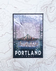 a final switchback button magnet featuring Katie Jeanne Reim's portland glow print