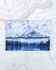 a final switchback button magnet featuring Katie Jeanne Reim's mount rainier morning print
