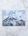 a final switchback button magnet featuring Katie Jeanne Reim's mount rainier summit print