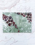 a final switchback button magnet featuring Katie Jeanne Reim's rose city print
