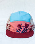 front view of the final switchback 5-panel trail hat featuring artist Katie Jeanne Reim's Paintbrush print