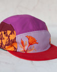 angle view of the final switchback 5-panel trail hat featuring artist Katie Jeanne Reim's Poppy print