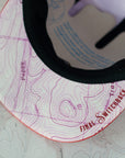brim view of the final switchback 5-panel trail hat featuring artist Katie Jeanne Reim's Poppy print