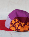 side view of the final switchback 5-panel trail hat featuring artist Katie Jeanne Reim's Poppy print