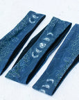 3 final switchback quick dry headbands featuring artist Katie Jeanne Reim's milkyway print