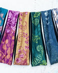 a collection of final switchback quick dry headbands featuring artist Katie Jeanne Reim's prints