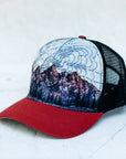angle view of the final switchback trucker hat featuring artist Katie Jeanne Reim's teton print