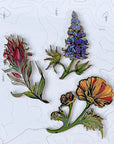 all three final switchback wildflower enamel pins created by artist Katie Jeanne Reim