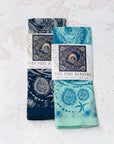 two final switchback cotton bandanas in tide pool blue and tidepool mint featuring artist Katie Jeanne Reim's prints