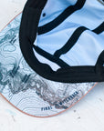 brim view of the final switchback 5-panel trail hat featuring artist Katie Jeanne Reim's Whitney print