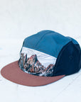 side angle view of the final switchback 5-panel trail hat featuring artist Katie Jeanne Reim's Whitney print