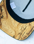 brim view of the final switchback trucker hat featuring artist Katie Jeanne Reim's Yosemite print