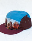 angle view of the final switchback 5-panel trail hat featuring artist Katie Jeanne Reim's Zion print
