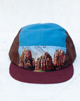 Front view of the final switchback 5-panel trail hat featuring artist Katie Jeanne Reim's Zion print