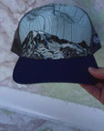 mount rainier summit trucker hat by final switchback featuring Katie Reim's art video
