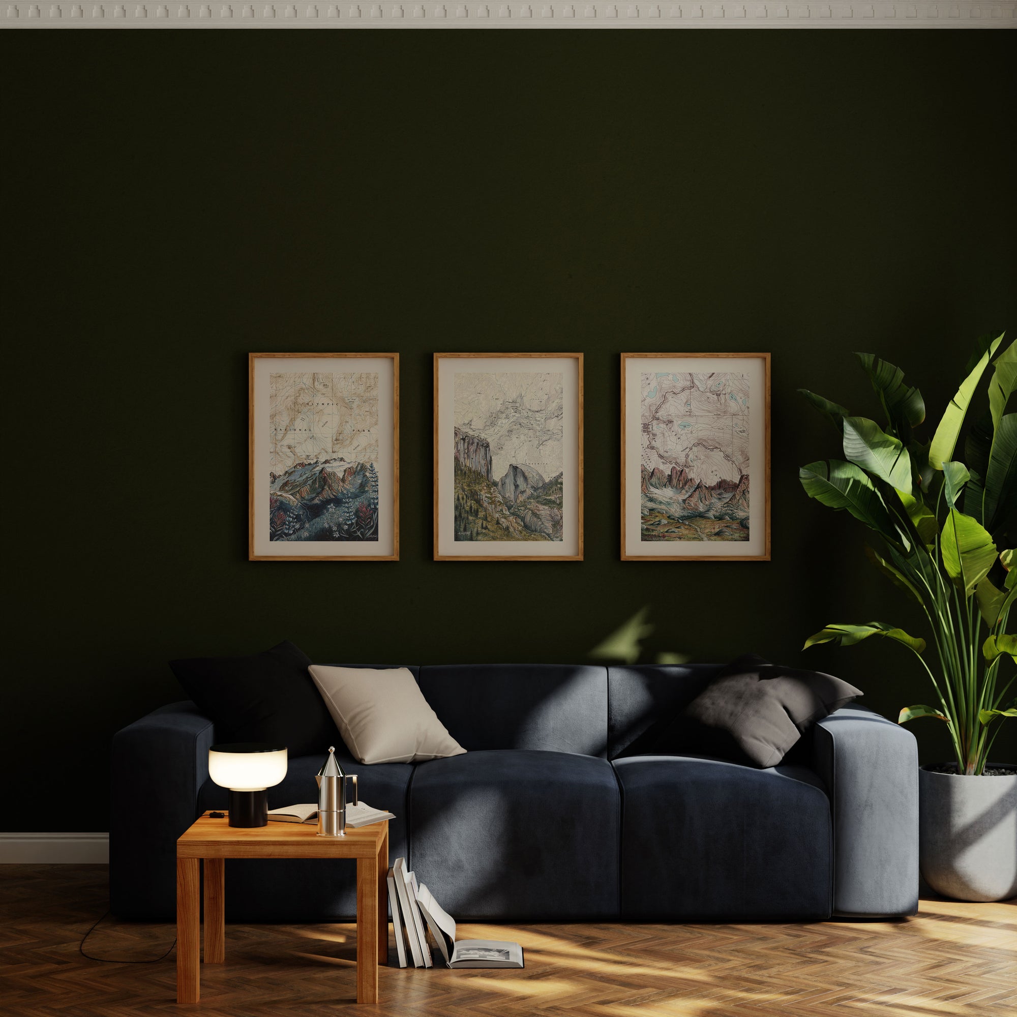 three Final switchback framed prints mounted on a green wall in a living room