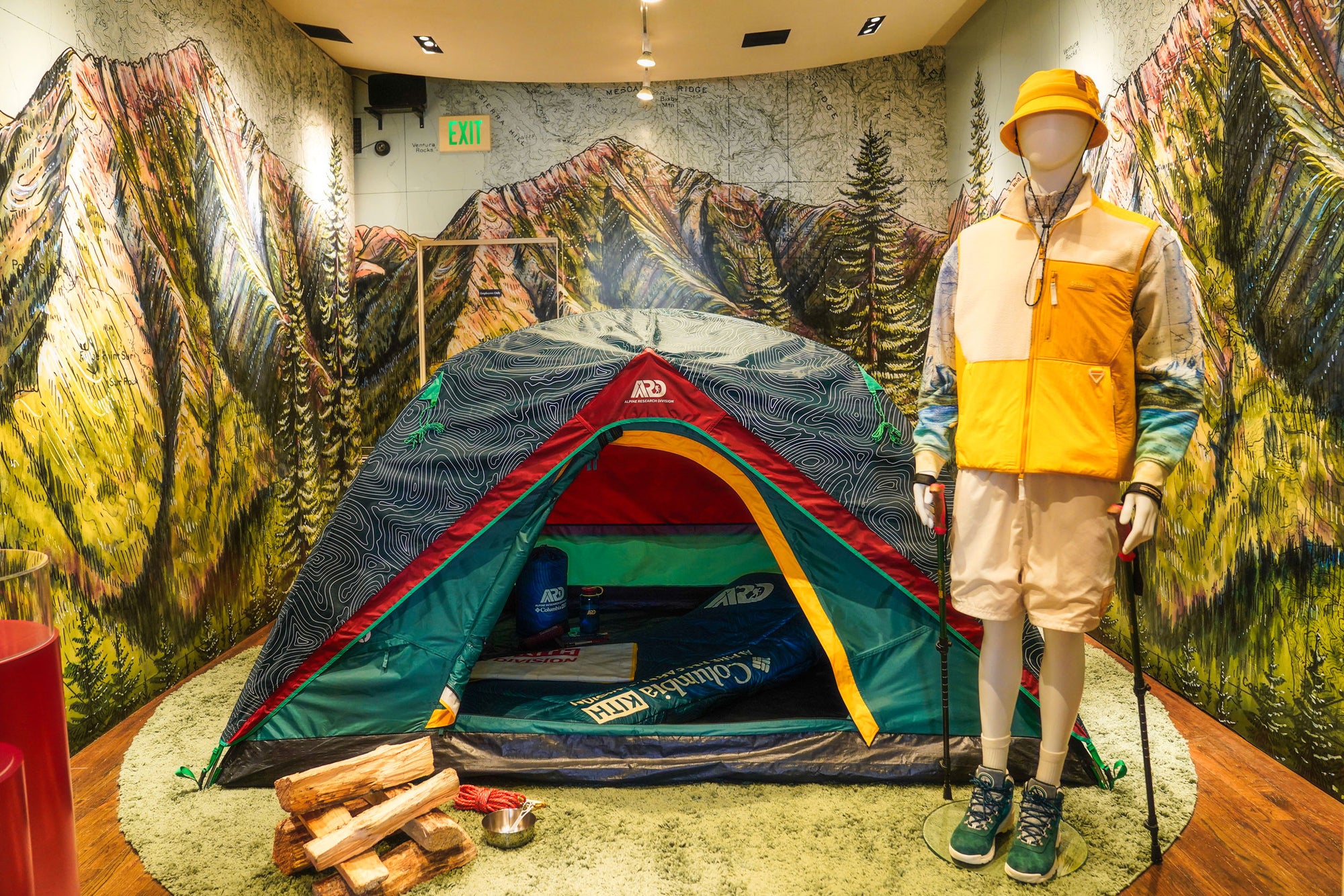 wall Muriel behind camping gear with a final switchback print for a custom commission project for Kith x Columbia