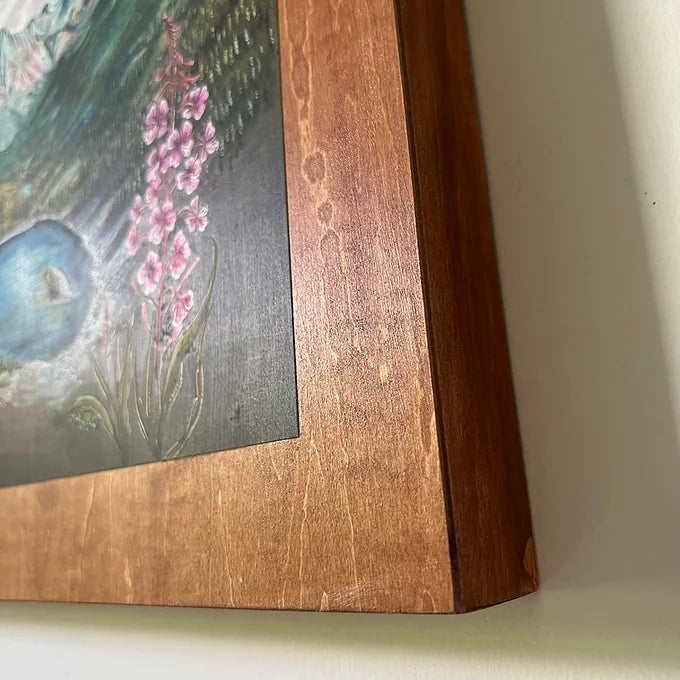 a close-up of the wooden frame holding a final switchback original painting by artist Katie Jeanne Ream