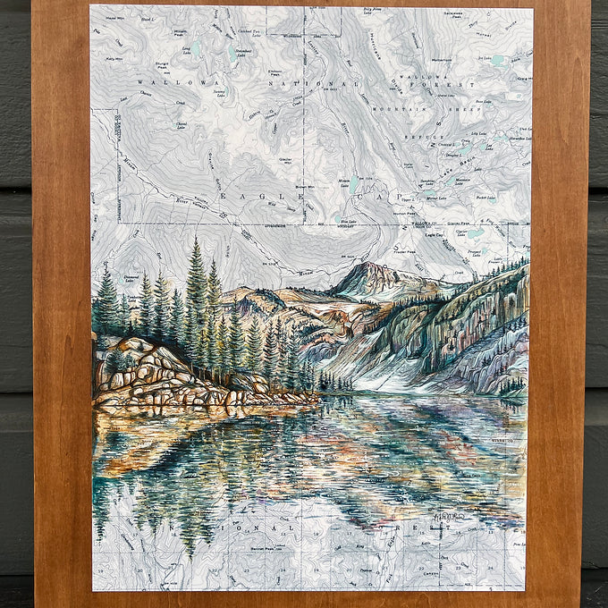 a close-up of the wallowas mirror lake eagle cap final switchback original painting in a wooden frame by artist Katie Jeanne Ream