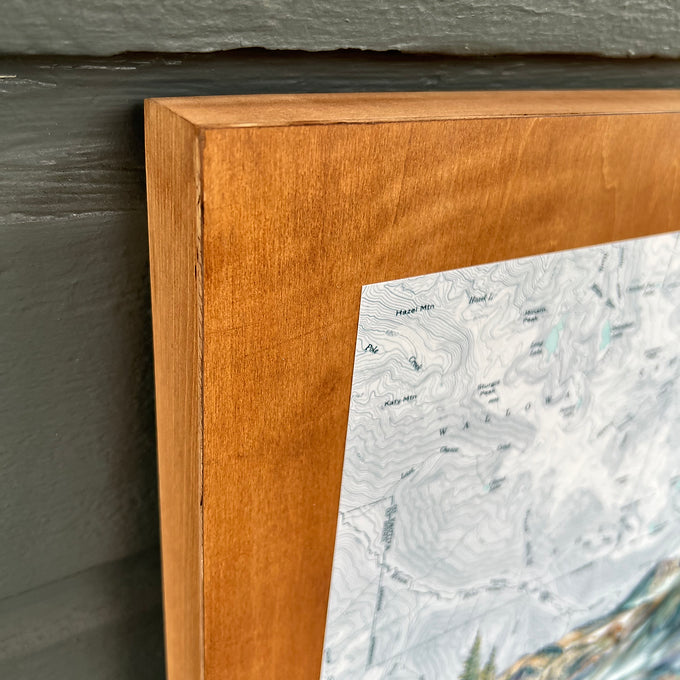 a close-up of the wooden frame holding a final switchback original painting by artist Katie Jeanne Ream