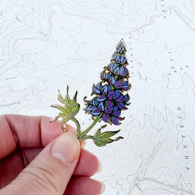 final switchback alpine lupine enamel pin created by artist Katie Jeanne Reim