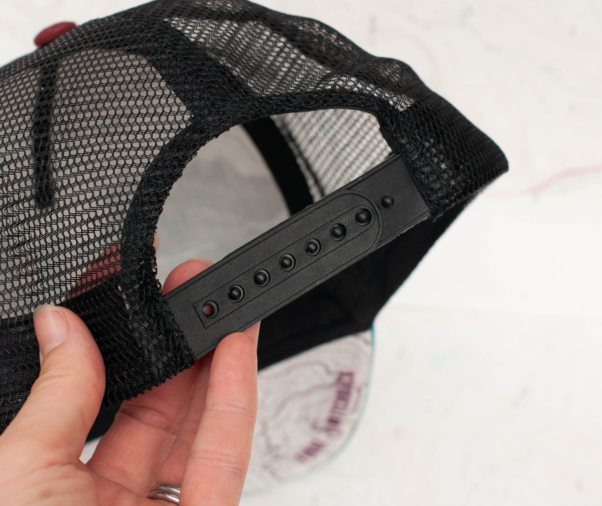 back view of the final switchback trucker hat featuring artist Katie Jeanne Reim&#39;s Broken Top print