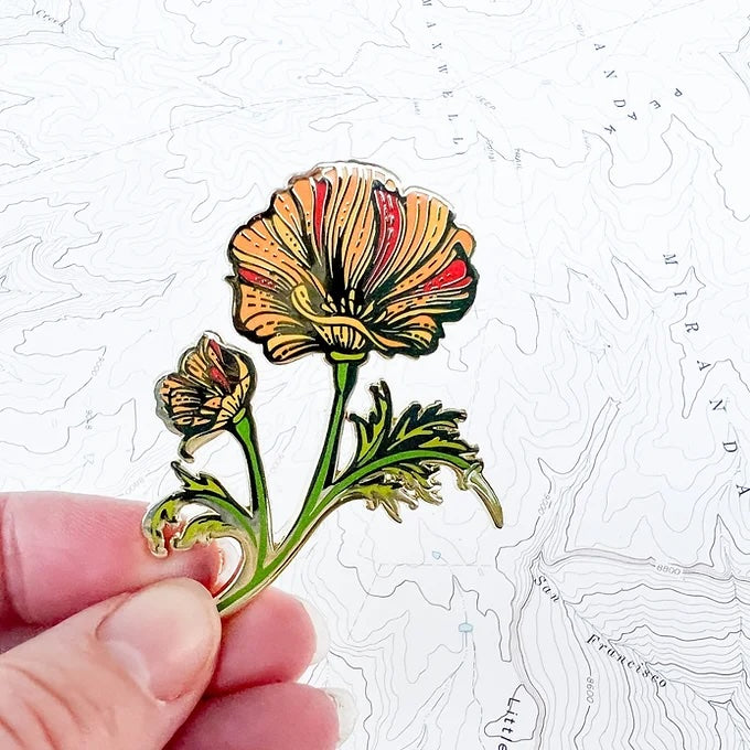 final switchback poppy enamel pin created by artist Katie Jeanne Reim