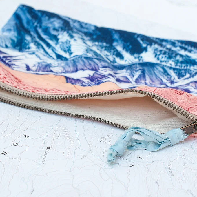interior view of a final switchback eco-friendly recycled zip pouch featuring artist Katie Jeanne Reim&#39;s Ridgeline print