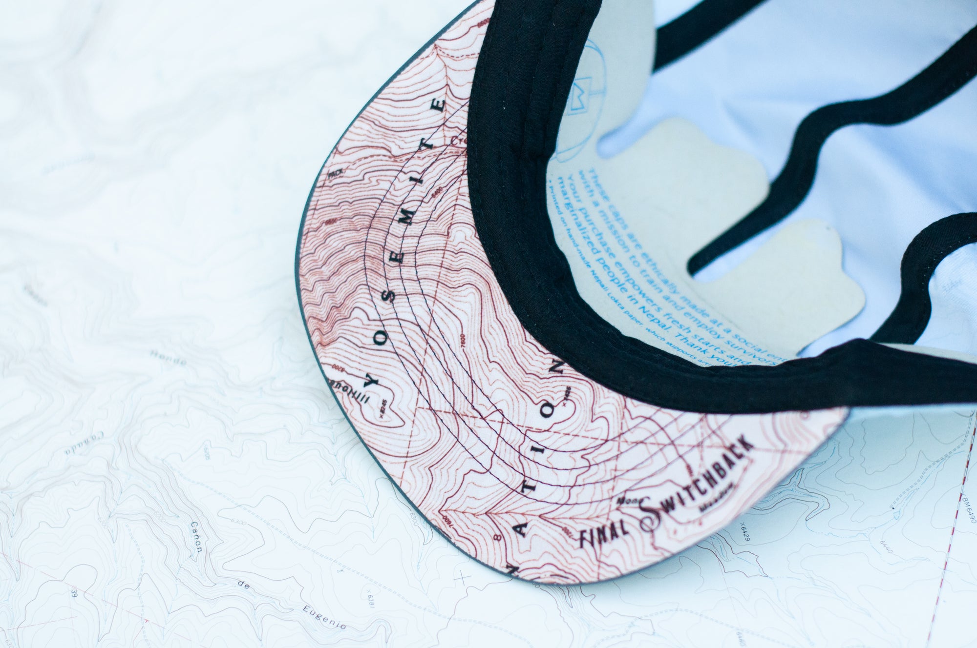 brim view of the final switchback 5-panel trail hat featuring artist Katie Jeanne Reim&#39;s half-dome print