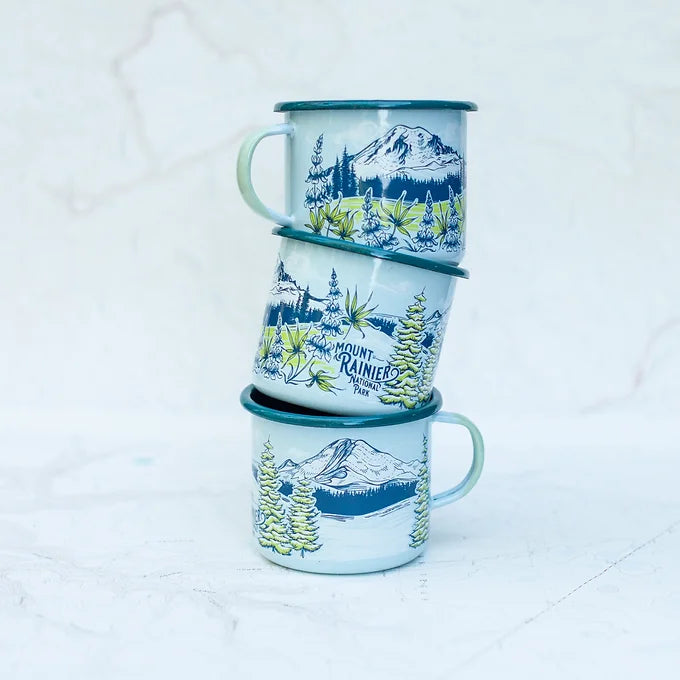 Three stacked final switchback fireproof enamel mugs featuring artist Katie Jeanne Reim's Mount Rainier Seasons print