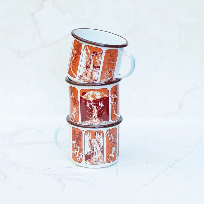 Three stacked final switchback fireproof enamel mugs featuring artist Katie Jeanne Reim's Mount Rainier Waterfalls print